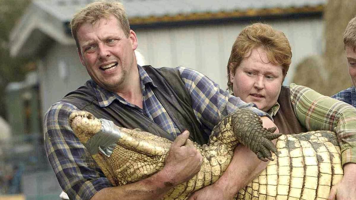 Hero wife of zoo owner who dived into crocodile pit to save three-year-old 'thrown in by stranger' - as boy fights for life and police question man, 30, for attempted murder